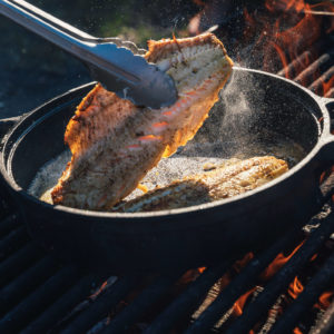 cooking fish over the fire