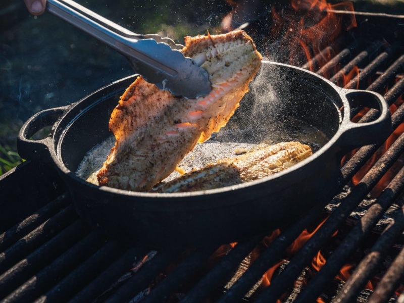 cooking fish over the fire