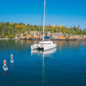 welcome island, catamaran and paddle boarding