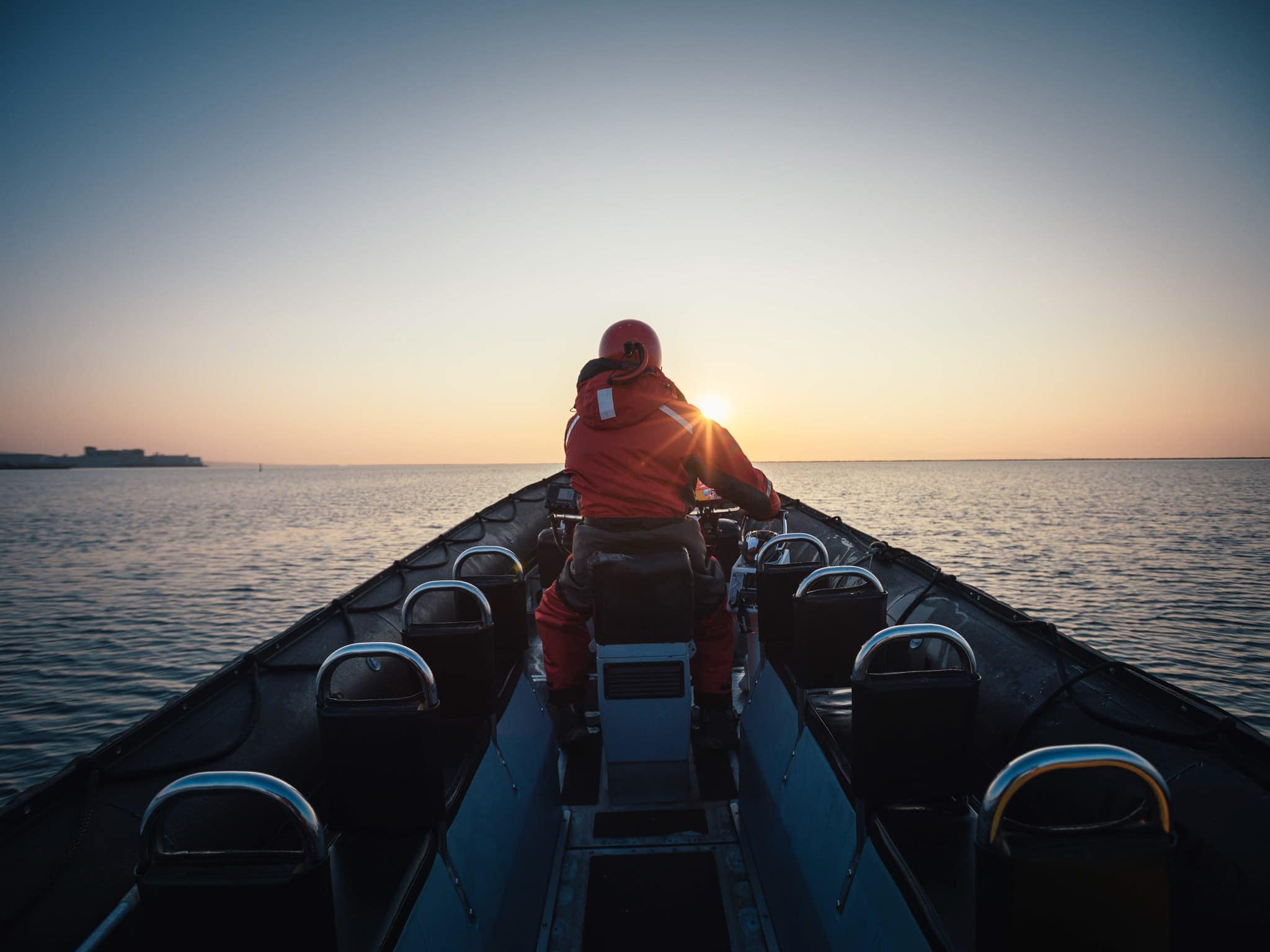full boat rear zodiac at sunrise